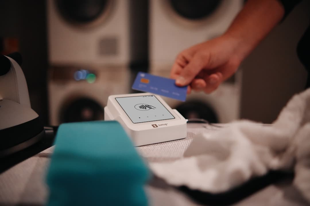 Paying with a card at the laundromat